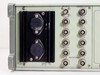 RE 107 Synthesized Signal Generator rear panel left section — dual heatsink-mounted power transistors and BNC output array labeled RF OUT, PILOT, EXT 2–6, SWEEP OUT, 400 Hz, 1 kHz, L+R, AM STEREO, L-R