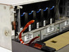 IBM 7133-D40 interior view showing row of SSA disk drive modules with blue handles and cabling