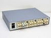 Astrocom 4100 rear panel full view showing IEC power inlet, toggle switch, and mixed RJ-45 and DB-style port connectors across all 16 channels