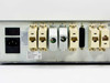 Astrocom 4100 rear panel left-side detail showing IEC AC inlet, power switch, ports 1–8 with mixed RJ-45 and DB connectors, and rating label