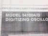 HP 54100A/D manual cover close-up showing title 'Operating and Programming Manual, Model 54100A/D Digitizing Oscilloscope'