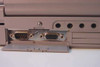 Toshiba Tecra 750CDM rear port bay showing DB-9 serial port and DB-15 VGA port with audio jacks