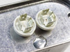 Aerovox Z62P4840M23 capacitor — close-up of dual ceramic terminal posts with blade tabs on top