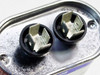 GE 27L6017S capacitor — top view showing dual blade tab terminals in rubber grommets