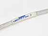 KMW 140223-2 Rev 2 label on braided RF cable body — part number and revision printed in blue on white label