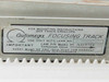 Automega Focusing Track label reading 'Use Only With Lens No.' and autofocus cam pin instructions