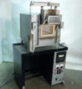 Hevi-Duty HDT-5610 electric box furnace front view — door open showing refractory chamber, mounted on black cabinet base with Barber-Colman controller panel below