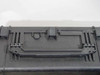 Close-up of hard case top panel showing retractable pull handle mechanism and pressure relief valve