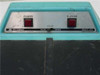 X-Rite 303 Sensitometer control panel close-up showing Power and Expose buttons, Blue/Green color selector, X-Rite Company branding and Model 303 label