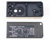 Photo-Sonics LB-24A KB-19 film magazine shell — interior cavity view showing black molded housing with drive spindle plate and mechanical mounting features, threading diagram lid removed