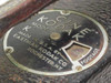 Close-up of Cine Kodak Model K nameplate reading 'Made in USA by Eastman Kodak Co., Rochester NY' with footage indicator dial