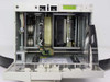 Quantum ATL L200 interior view with front door open showing DLT tape drive mechanism, robotic cartridge picker arm, and tape magazine slots