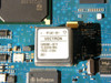 Ericsson CBU1 PCB close-up of Vectron oscillator module C4550B2-0015 (10.000000 MHz) and adjacent Infineon and Intel ICs