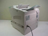 Minolta MinoltaFax 2800 rear three-quarter view showing right side panel with rating label, power cord connected, and ventilation grilles