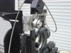 Oxberry 1500 camera carriage close-up showing pan/tilt head mount, gear ring, precision lead screw, and dial indicator