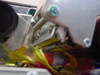 Closeup of ribbon path interior showing yellow and red ribbon material and mechanical transport components