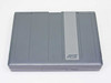 AST PowerExec 3/25SL closed top view — two-tone gray lid design with AST logo
