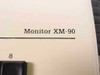 Close-up of Oxford Monitor XM-90 model designation printed on the right side of the front panel