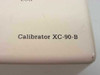 Close-up of Oxford Calibrator XC-90-B model label on lower front panel