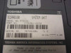 Toshiba Tecra 8100 PT810U-12C52 bottom label showing model number, part number, serial number, and DC 15V 4.0A power rating