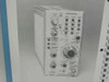 Interior page of Tektronix 7B85 manual showing black-and-white photograph of the 7B85 Delaying Time Base plug-in front panel with triggering, delay mode, and time/div controls
