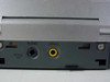 Initial IDM-9530 rear/side port panel showing Optical Out, Audio Out (3.5mm), and Video Out (RCA composite) jacks