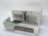 ADIC DAT Autochanger 1200C-001 — interior view with top cover and front bezel removed, showing tape carousel mechanism, robotic picker arm, linear guide rails, and green PCB assembly