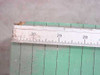 Close-up of the 30-inch ruler end of the Photo Materials Co. Premier cutting board showing scale markings and worn corner