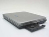 TAIO Jetbook 700 left side showing open 24x CD-ROM drive bay with disc tray extended