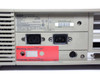 Wang PC240-3 rear panel close-up — dual IEC power connectors, red 115V factory-set warning sticker, DB9 and DB25 I/O ports visible