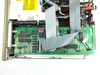Wang PC240-3 motherboard close-up — green PCB with multiple ICs, ribbon cable connectors, and expansion headers visible