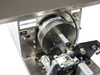 Micro Tooling MT0268 close-up of rotary chuck disc and pneumatic bearing feed actuator sub-assembly with AMMEX 036 label visible
