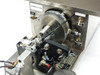 Micro Tooling MT0268 close-up of chuck area showing pneumatic actuator, BW-0186 labeled component block, feed mechanism, and Finger Lock toggle switch panel