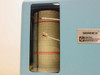 Close-up of Bacharach 22-7008 chart drum window showing cylindrical chart roll with red ink traces and Serdex / United Technologies Bacharach label plate