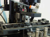 Applied Magnetics SFL Grammer 559883 — close-up of head alignment tooling and pneumatic actuator assembly with precision fixtures