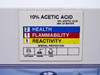 NFPA hazard label: 10% Acetic Acid / 90% DI Water – Health 2, Flammability 1, Reactivity 1 with corrosive and apron PPE icons