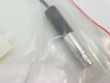 Close-up of Trimedyne 317 fiber optic cable connector end showing metal ferrule and black strain relief boot