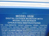 Close-up of Model 5528 operating instructions label — Digital Oxygen Monitor with Model 5510 Sensor calibration and alarm setting instructions