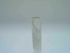 Close-up of chipped top edge of TMA quartz sample column showing chip and crack at the open end of the tube