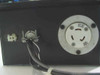 Side/bottom of panel showing NEMA L5-20 locking power inlet rated 20A 125V and a smaller connector with attached power cable