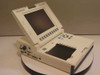 Telectronics Pacing Systems 9602 Network Programmer — three-quarter front view with flip-up display open and front-panel controls visible