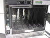 Sun StorEDGE L280 interior view with door open showing empty tape cartridge magazine slots and robotic picker mechanism