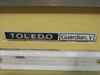 Toledo 8211 Guardian V nameplate closeup – model, serial number, fact number, voltage, amps, frequency, and Reliance Electric Co. markings