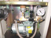 Omation 501 internal cabinet showing Gast vacuum pump, pressure regulator, gauge, and cooling fan