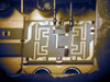 Microscope close-up of limiter internal microwave circuit substrate showing spiral/meander transmission line traces and surface-mount components