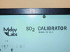 Meloy Labs CS10-2 SO2 Calibrator — close-up of front panel label reading SO2 Calibrator Model CS10-2 with handwritten markings
