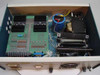 Interior top view of Superior Electric Modulynx DRD001 enclosure showing two Modulynx drive boards with heatsinks, large capacitor, transformer, and resistor arrays