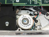 Archive 2150L tape drive – closeup of reel/drive motor labeled NB8206-M2, C/N 215471201 Rev F, LOT 9040, Singapore, with white and green wires attached