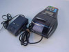 Dassault Talento 2UD terminal with thermal printer paper and power adapter — side angle view