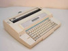 Sears 161 electronic typewriter angled left-side view showing carriage, paper guide, and keyboard layout